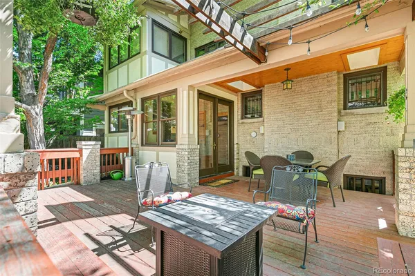 a view of a dinning tables and chairs in a patio of the house