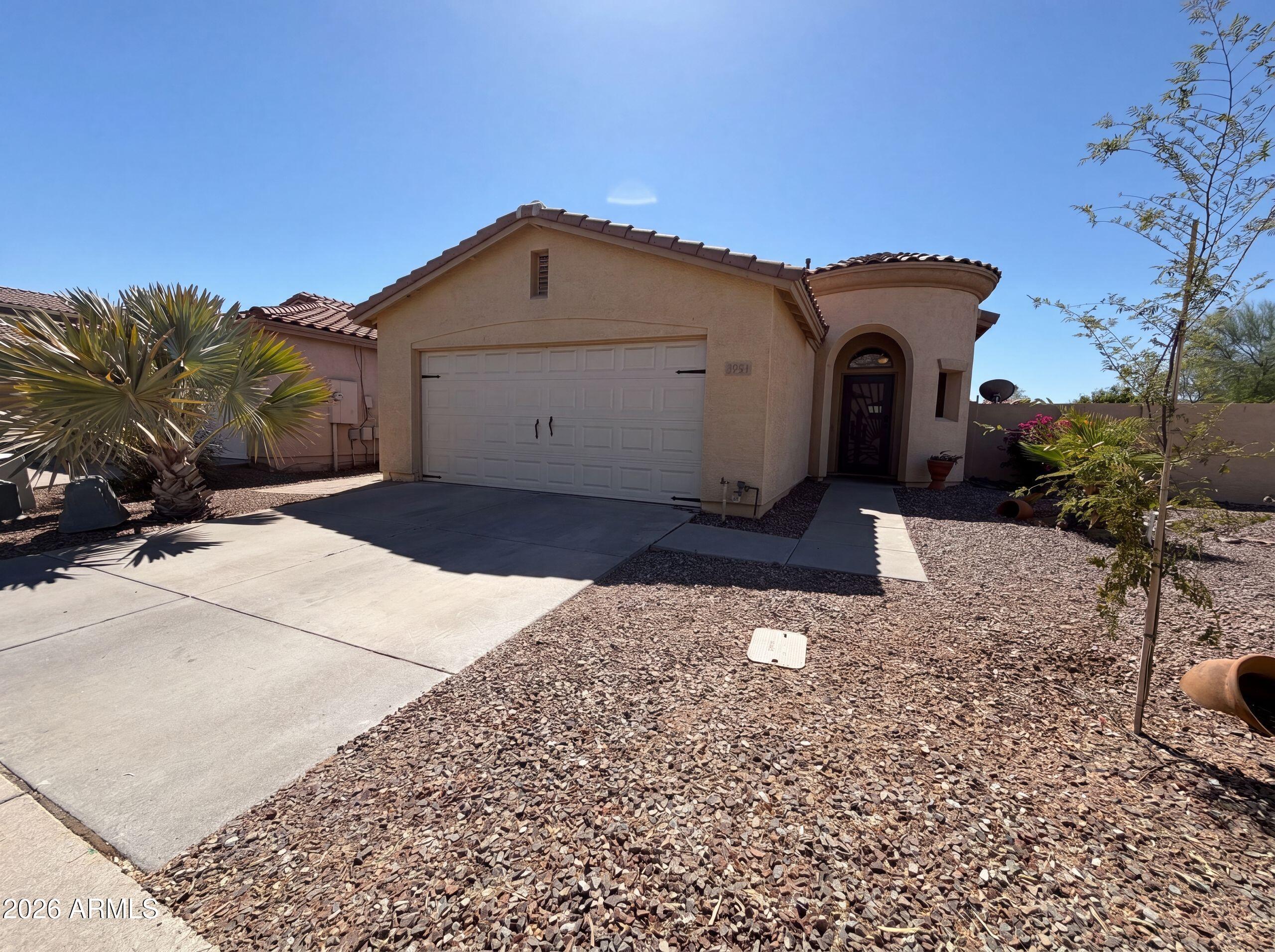 3951 East Timberline Road Gilbert, AZ 85297 - Photo 1 of 28 a view of a house with a yard