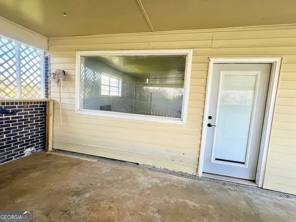 a room with water heater and a window