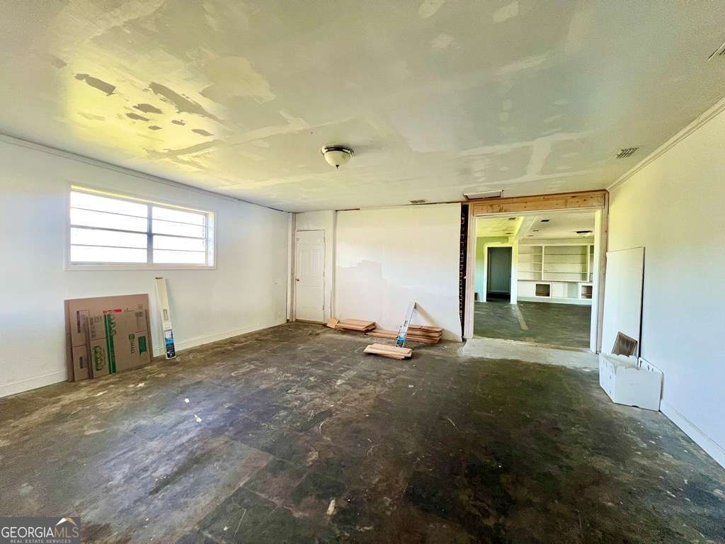 82 Cook Road Hazlehurst, GA 31539 - Photo 22 of 57 a view of a livingroom with wooden floor and a bathroom