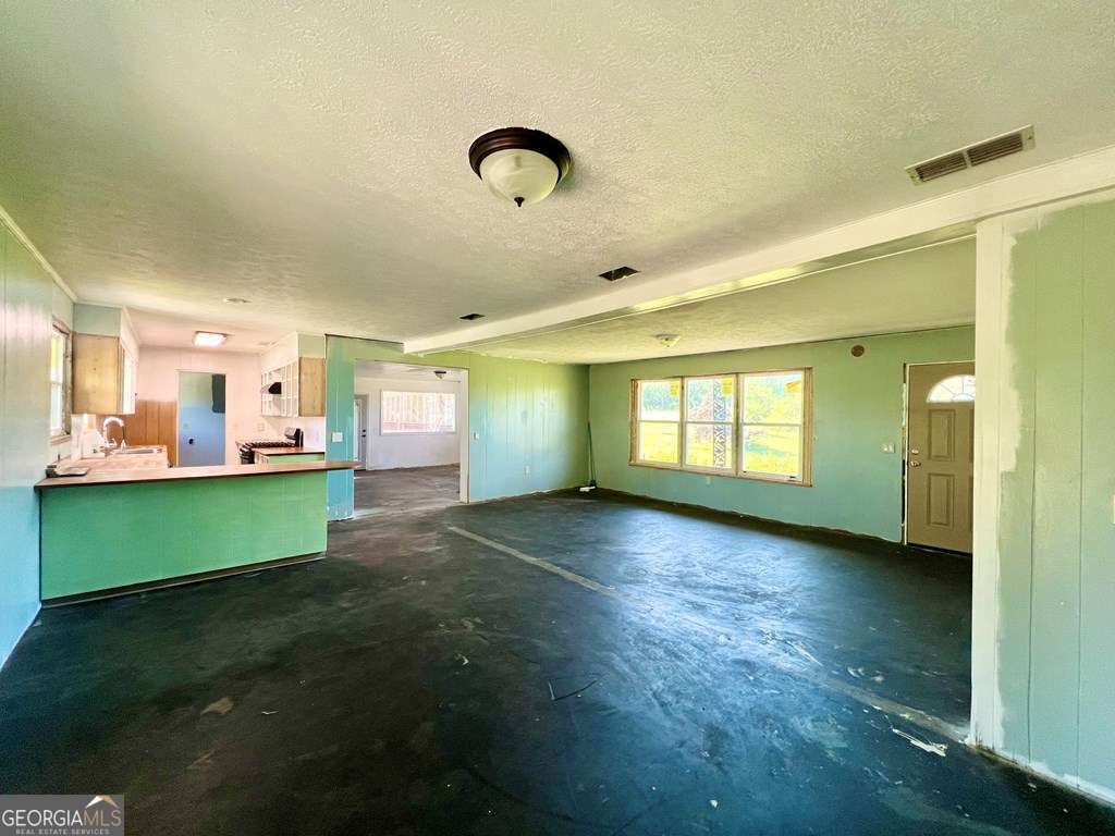 82 Cook Road Hazlehurst, GA 31539 - Photo 29 of 57 a view of room with kitchen and a window