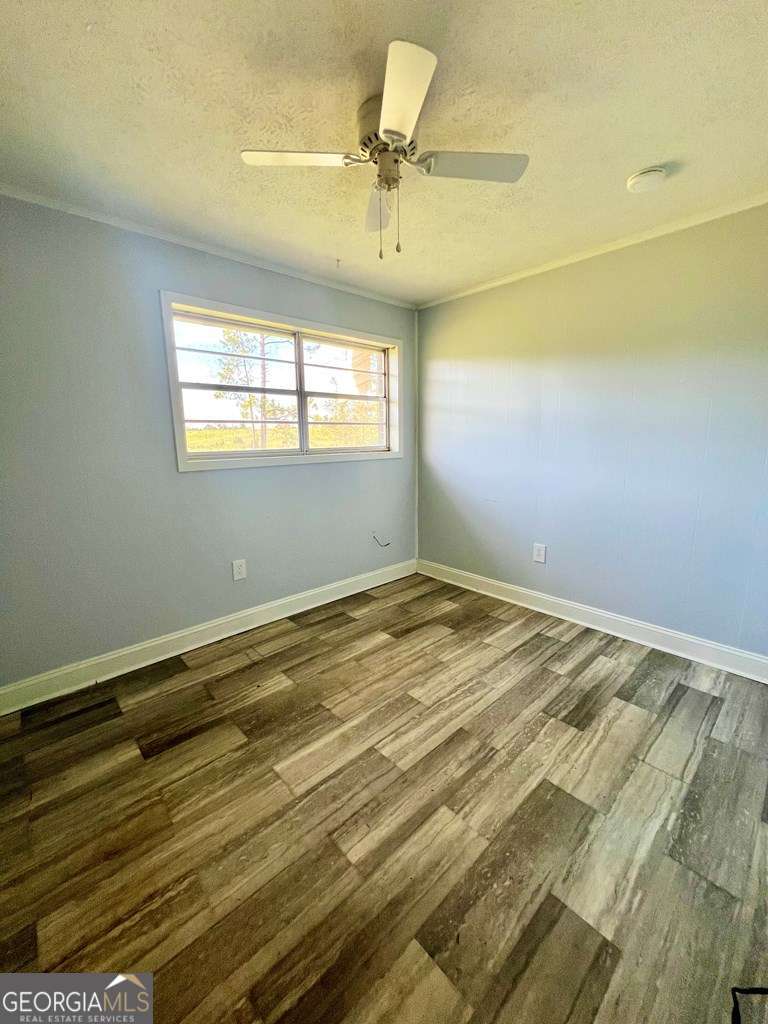 82 Cook Road Hazlehurst, GA 31539 - Photo 35 of 57 a view of a room with a window and ceiling fan