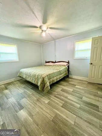a kitchen with a sink a counter top and a window
