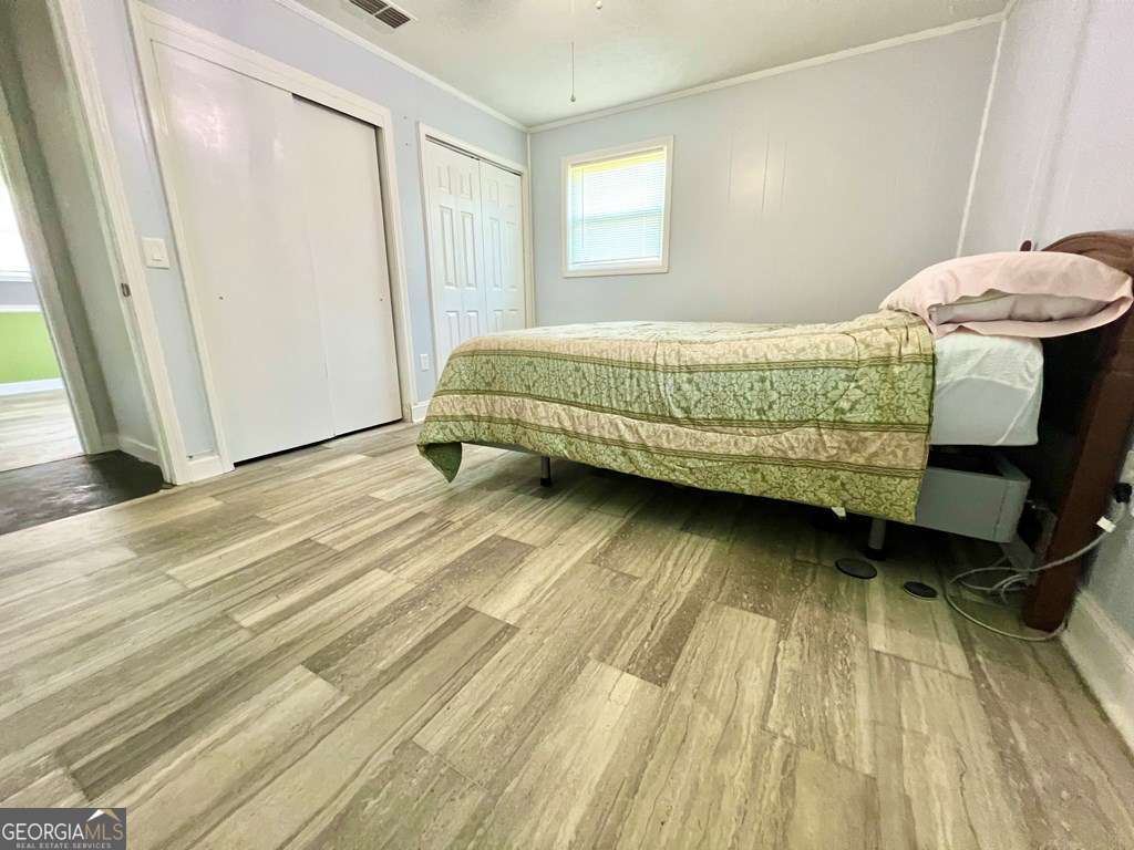 82 Cook Road Hazlehurst, GA 31539 - Photo 42 of 57 a bedroom with a bed and a window