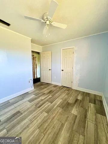 a view of an empty room with windows