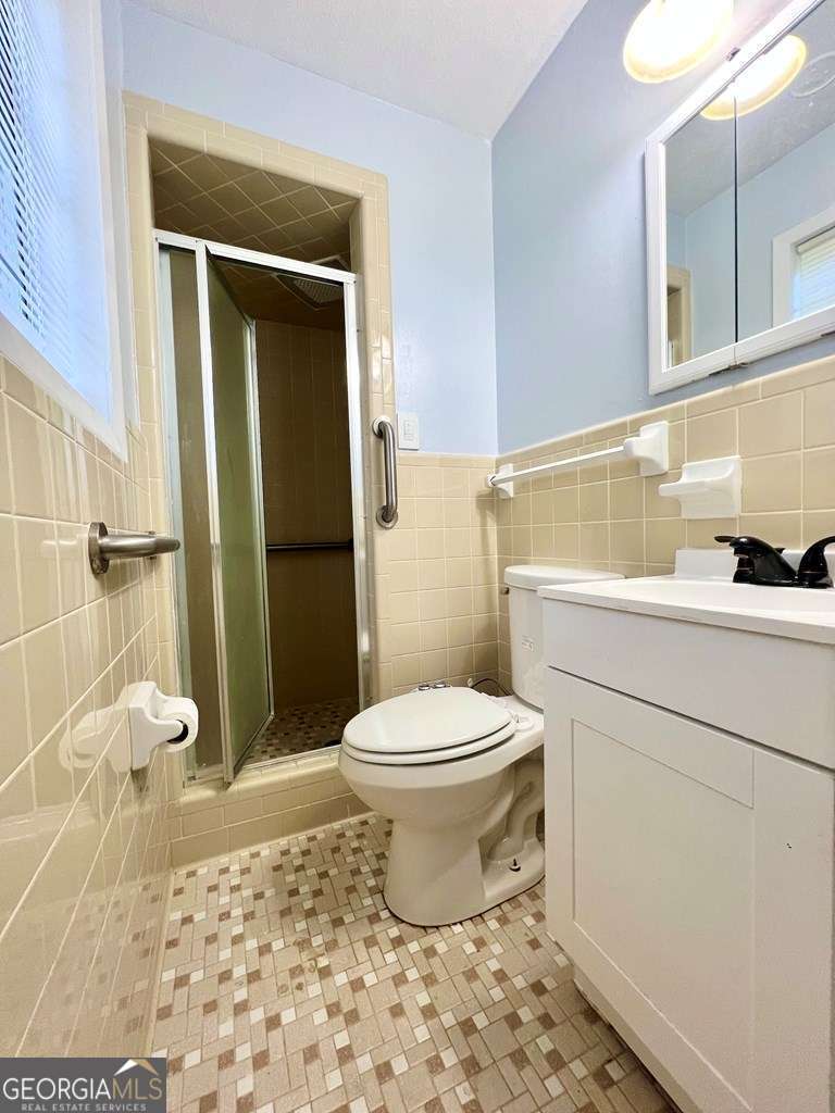 82 Cook Road Hazlehurst, GA 31539 - Photo 44 of 57 a bathroom with a toilet and a shower