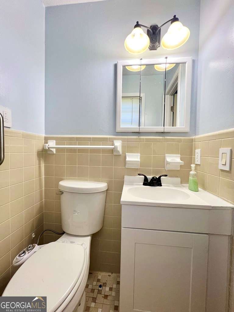 82 Cook Road Hazlehurst, GA 31539 - Photo 46 of 57 a bathroom with a sink a toilet and mirror