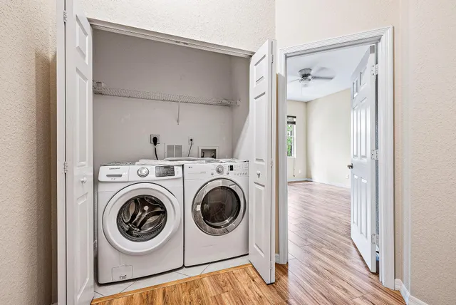 a view of a hallway with washer and dryer