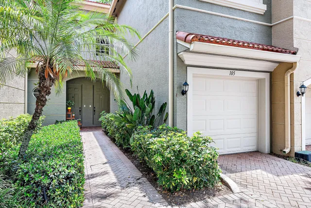 a potted plant sitting in front of a house