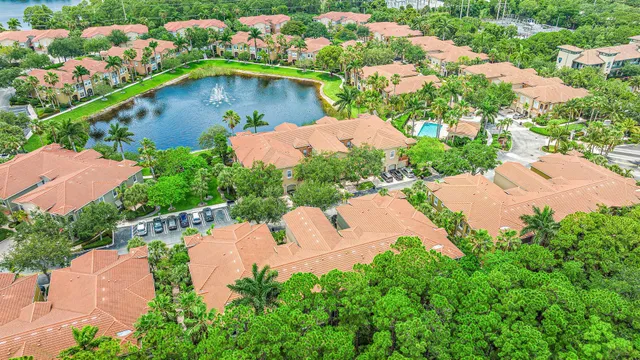 an aerial view of a house with a garden and swimming pool