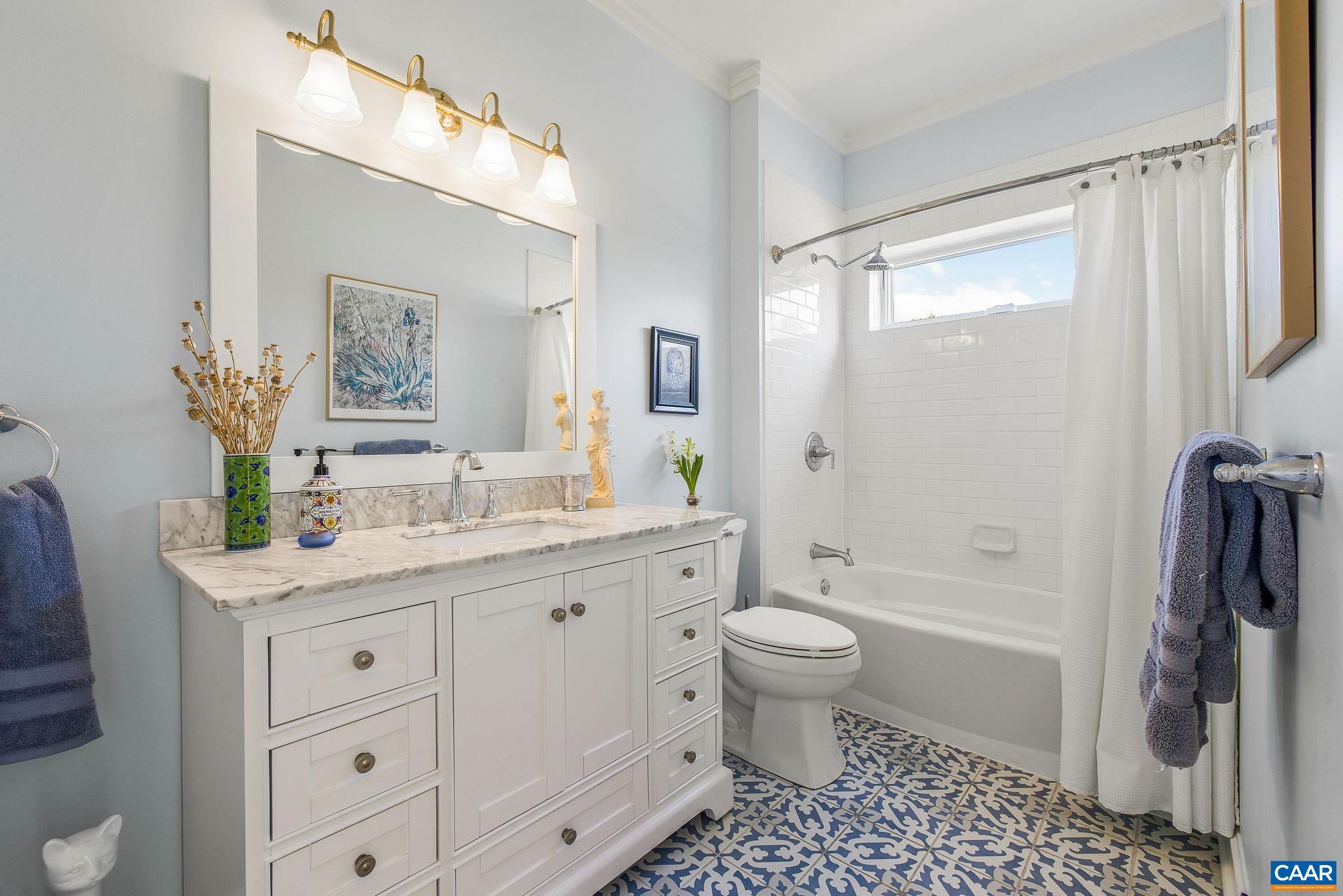 4764 Advance Mills Road Earlysville, VA 22936 - Photo 57 of 72 a bathroom with a granite countertop sink toilet a large mirror a shower and a bathtub