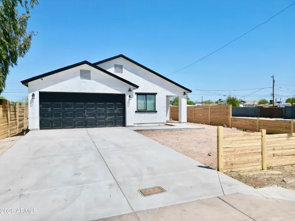 a front view of a house with garage