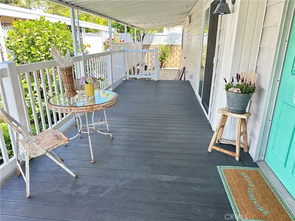 a view of balcony with furniture