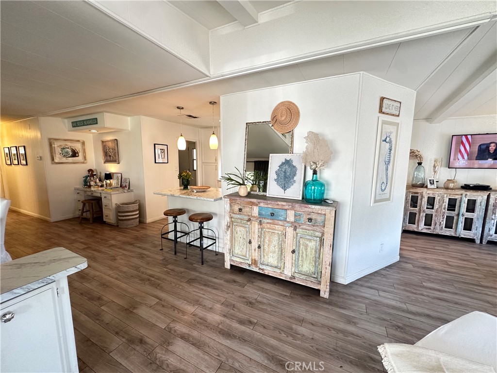 24701 Raymond Way, Unit 45 Lake Forest, CA 92630 - Photo 6 of 14 a living room with furniture and wooden floor