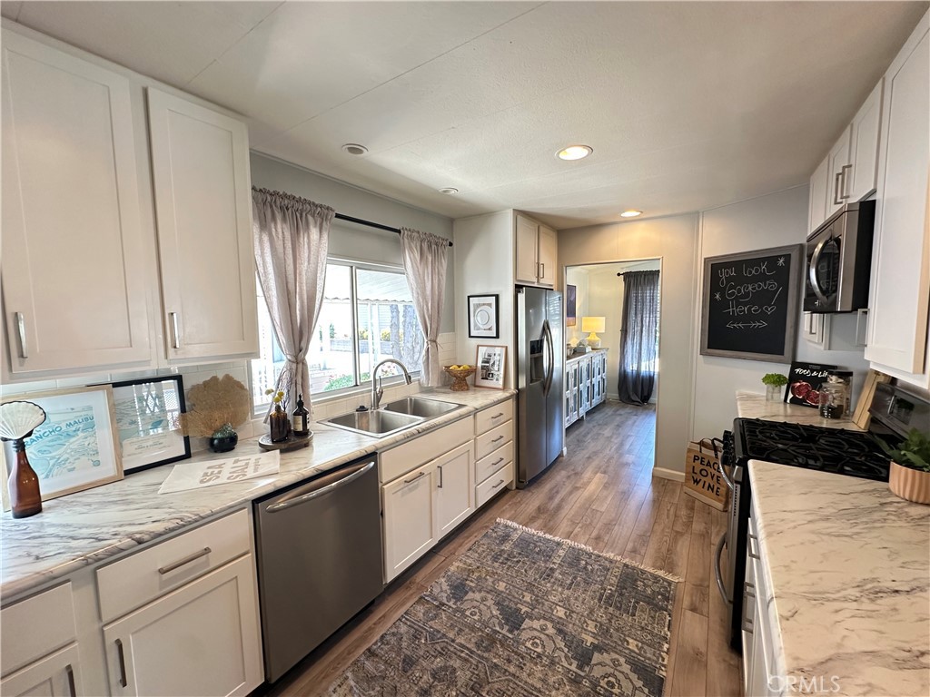 24701 Raymond Way, Unit 45 Lake Forest, CA 92630 - Photo 10 of 14 a large kitchen with a lot of counter space
