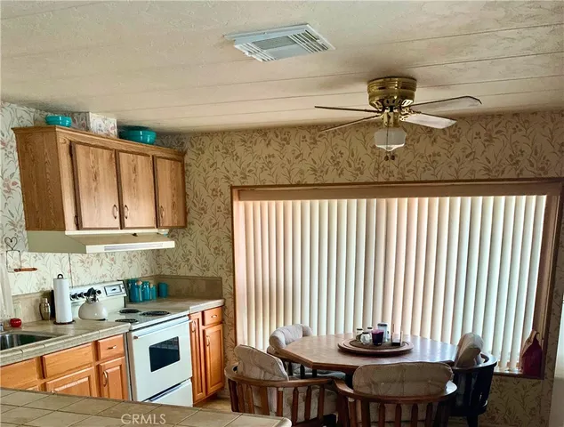 a view of a kitchen with a sink and cabinets