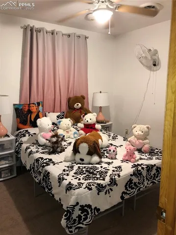 a bedroom with a bed and a mirror