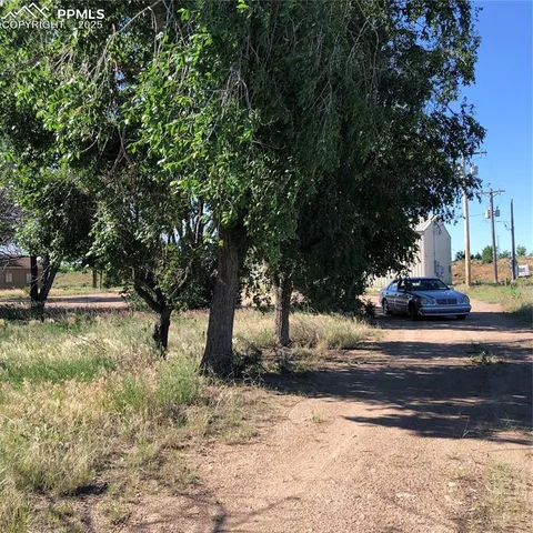 a view of a yard with a lake view
