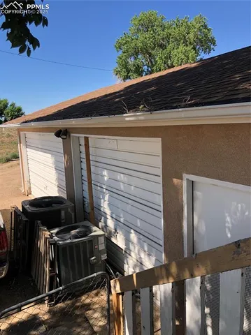 a kitchen with a refrigerator and a stove top oven