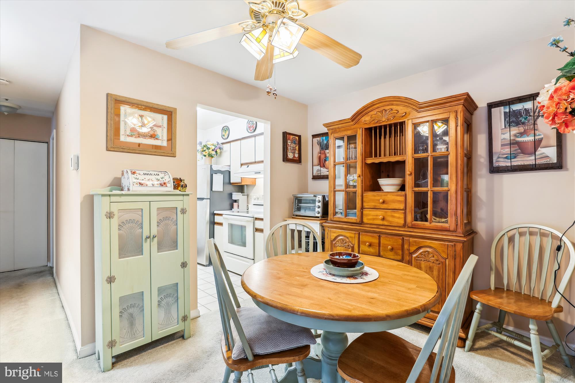 4912 Columbia Road, Unit 1 110 Columbia, MD 21044 - Photo 13 of 59 a view of a dining room with furniture wooden floor and chandelier