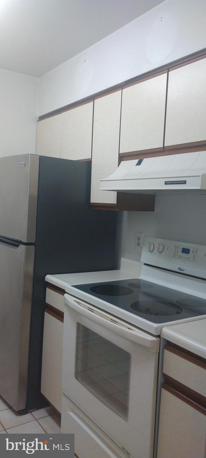 4912 Columbia Road, Unit 1 110 Columbia, MD 21044 - Photo 18 of 59 a view of storage and utility room with washer and dryer