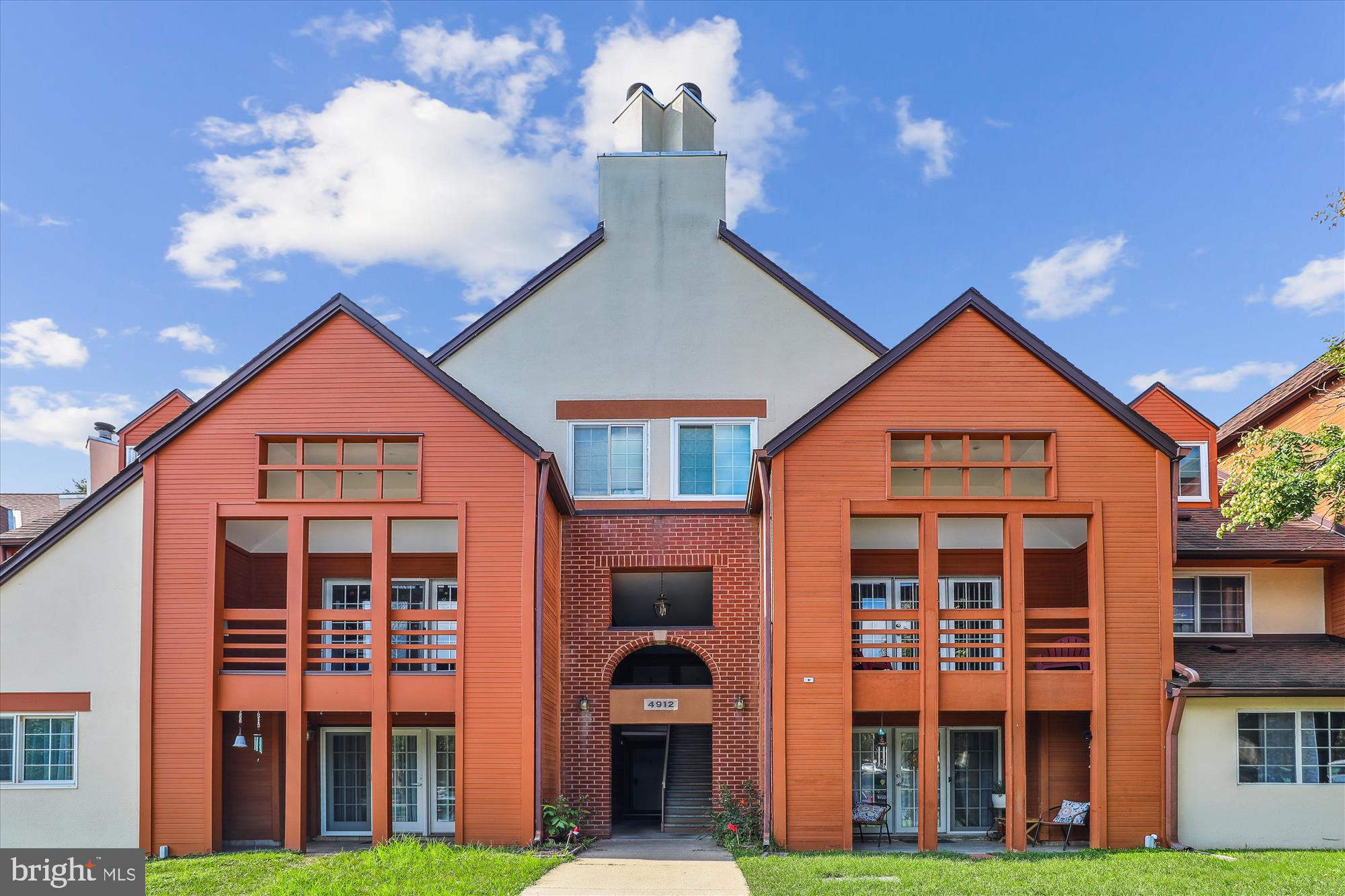 4912 Columbia Road, Unit 1 110 Columbia, MD 21044 - Photo 2 of 59 a front view of a house with a yard