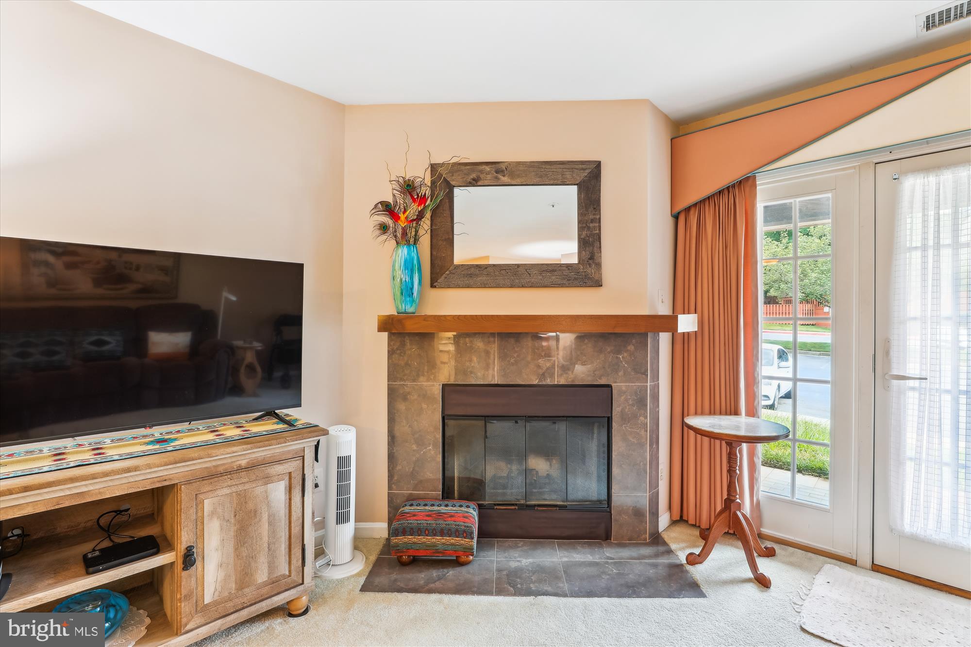 4912 Columbia Road, Unit 1 110 Columbia, MD 21044 - Photo 23 of 59 a living room with a fireplace and a flat screen tv
