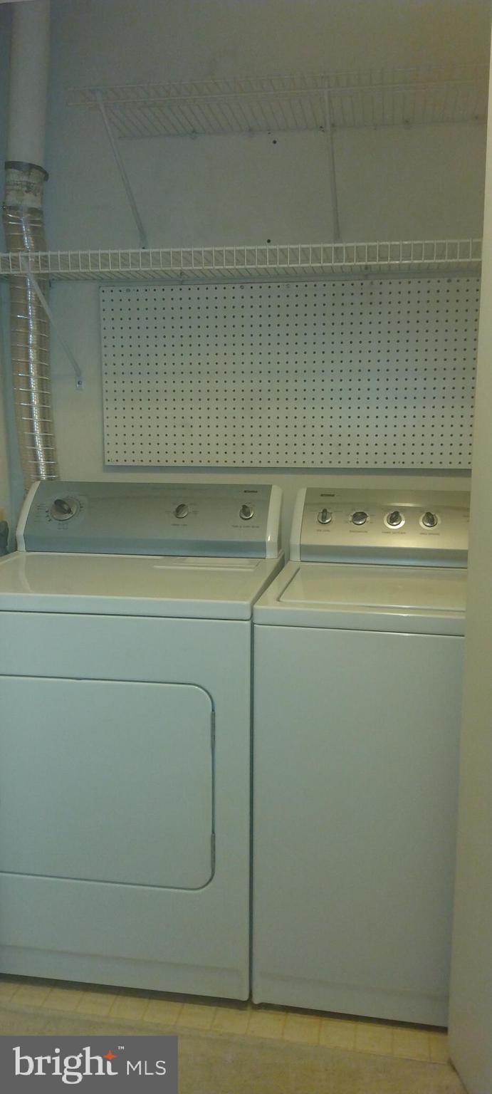 4912 Columbia Road, Unit 1 110 Columbia, MD 21044 - Photo 29 of 59 a utility room with dryer and washer