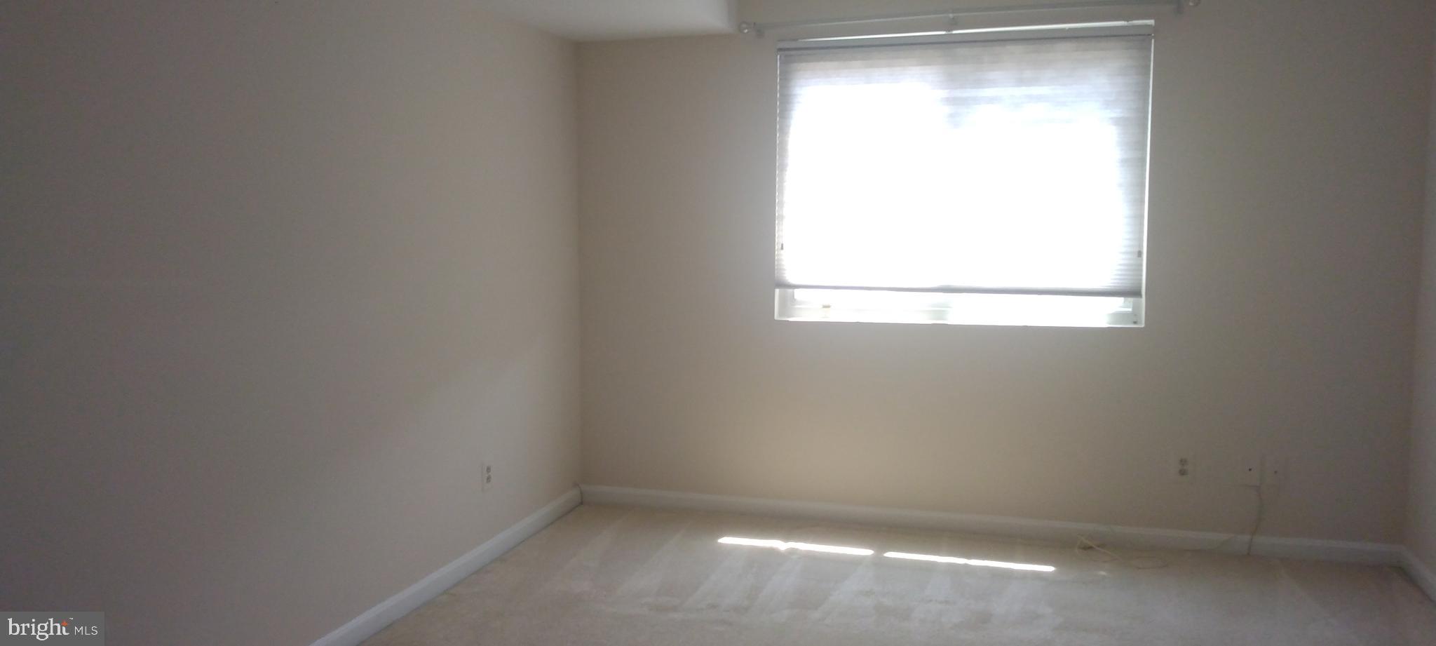 4912 Columbia Road, Unit 1 110 Columbia, MD 21044 - Photo 30 of 59 an empty room with a window