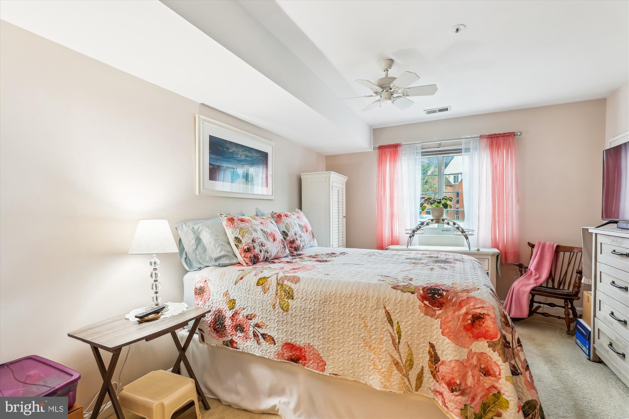 4912 Columbia Road, Unit 1 110 Columbia, MD 21044 - Photo 31 of 59 a bedroom with a bed and wooden floor