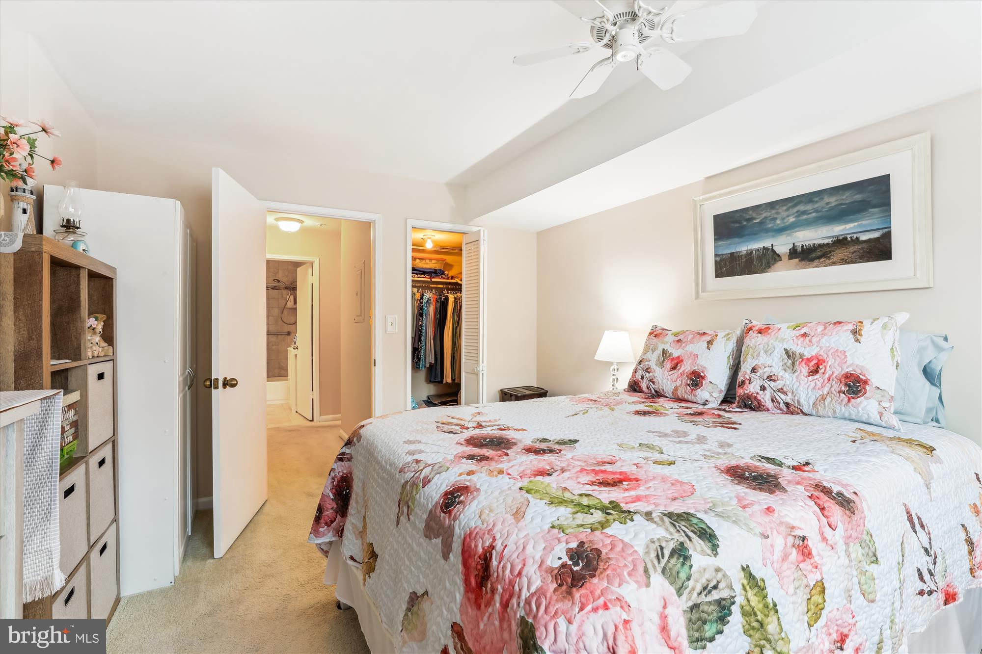 4912 Columbia Road, Unit 1 110 Columbia, MD 21044 - Photo 34 of 59 a bedroom with a bed and a chandelier