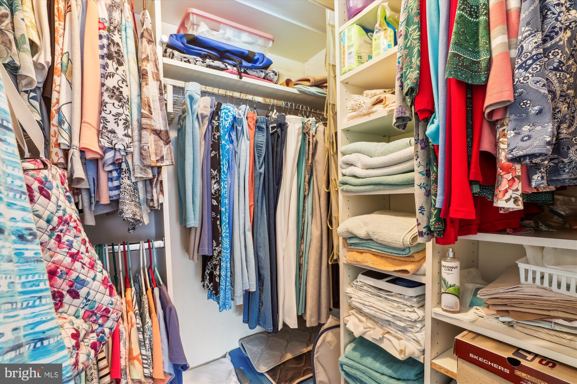 4912 Columbia Road, Unit 1 110 Columbia, MD 21044 - Photo 35 of 59 a view of walk in closet with clothes and shoes