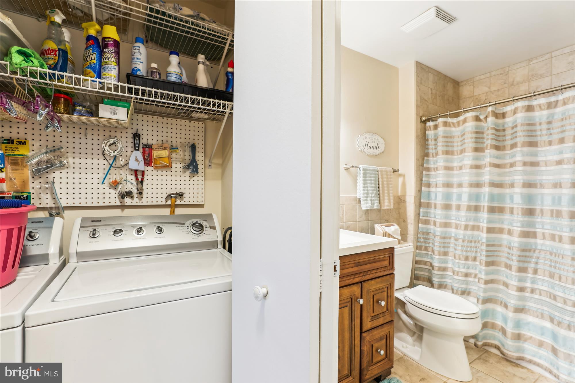 4912 Columbia Road, Unit 1 110 Columbia, MD 21044 - Photo 38 of 59 a bathroom with a toilet and a shower curtain