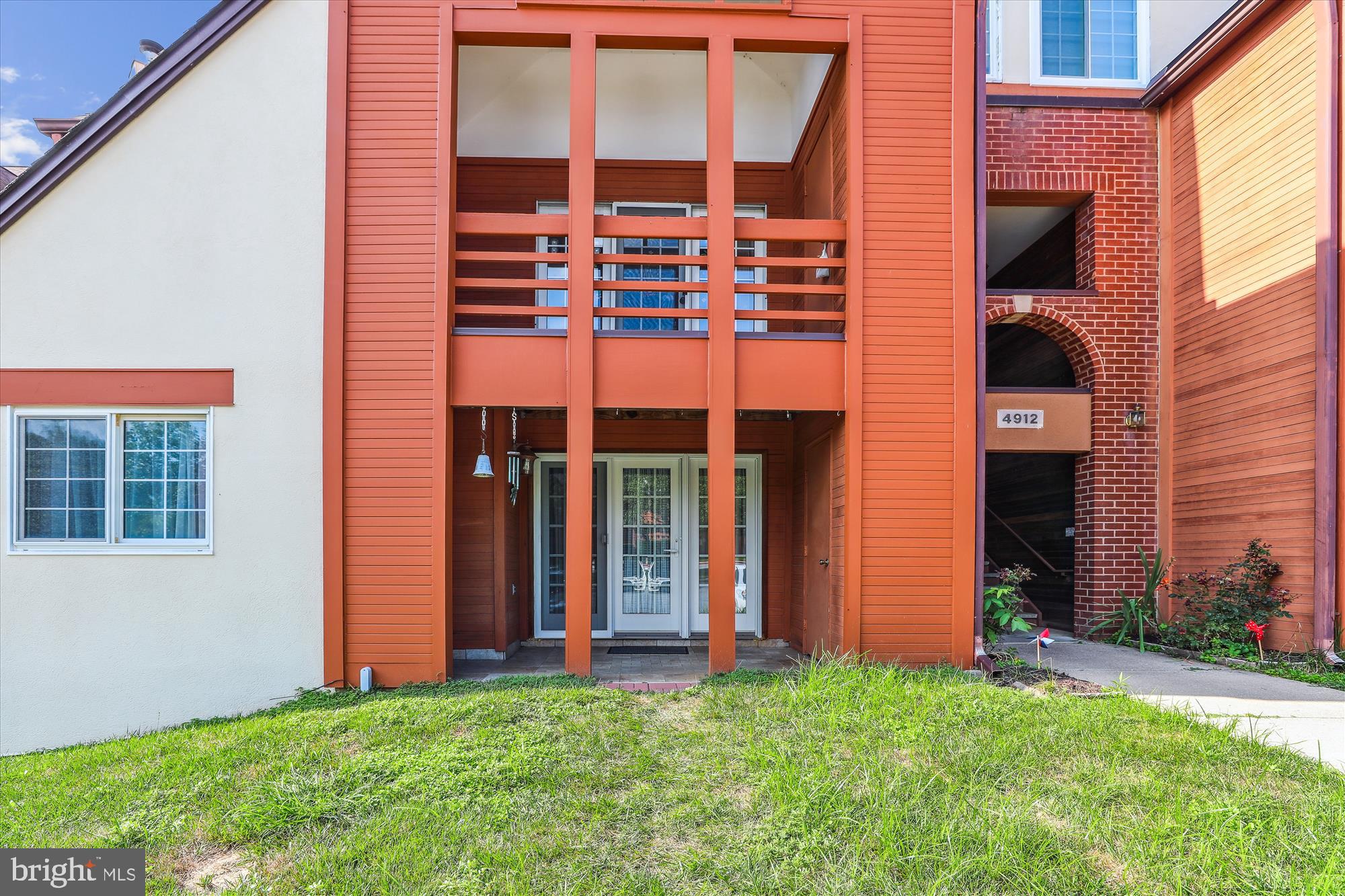 4912 Columbia Road, Unit 1 110 Columbia, MD 21044 - Photo 4 of 59 front view of a house with a yard