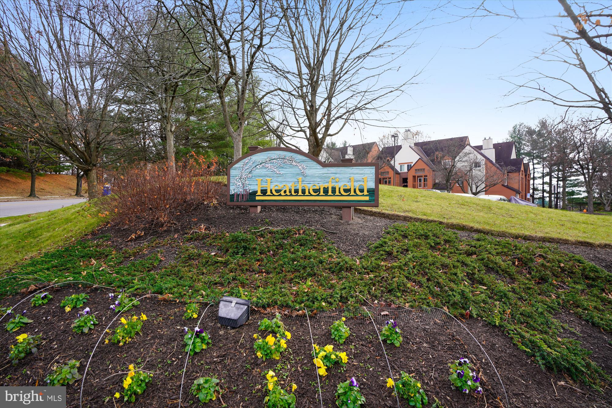 4912 Columbia Road, Unit 1 110 Columbia, MD 21044 - Photo 40 of 59 a sign that is sitting in the middle of a garden