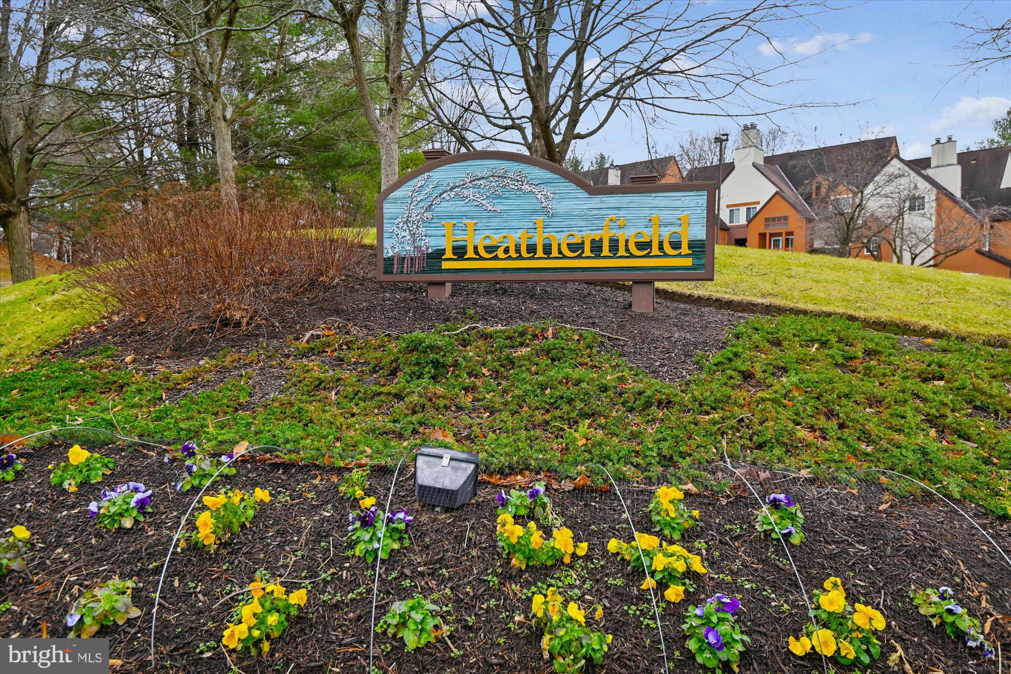 4912 Columbia Road, Unit 1 110 Columbia, MD 21044 - Photo 41 of 59 a sign that is sitting in front of flowers
