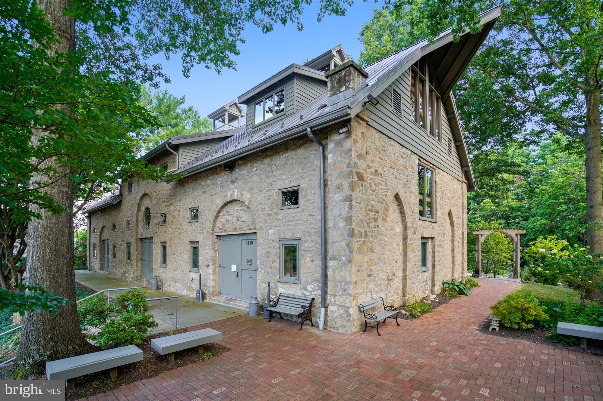 4912 Columbia Road, Unit 1 110 Columbia, MD 21044 - Photo 57 of 59 a front view of a house with a garden
