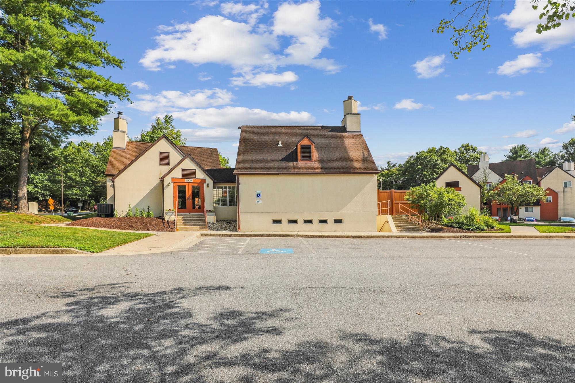 4912 Columbia Road, Unit 1 110 Columbia, MD 21044 - Photo 6 of 59 a front view of a house with a yard and garage