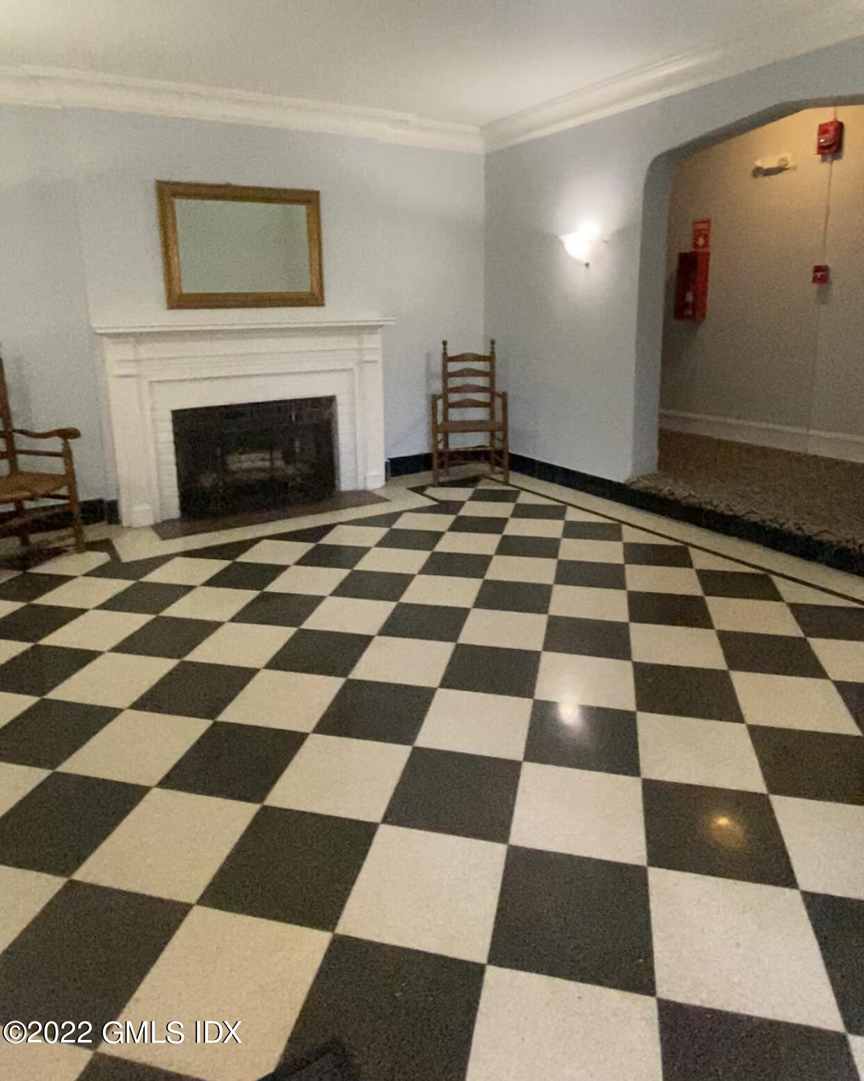 169 Mason Street, Unit 1F Greenwich, CT 06830 - Photo 3 of 14 a black and white checkered floor