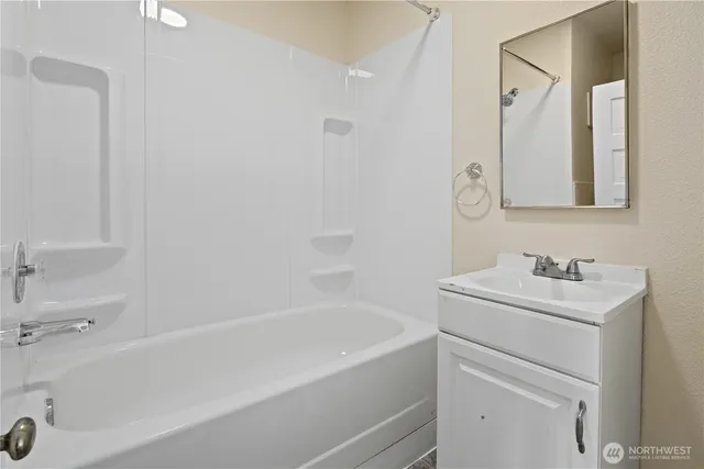 a utility room with sink dryer and washer