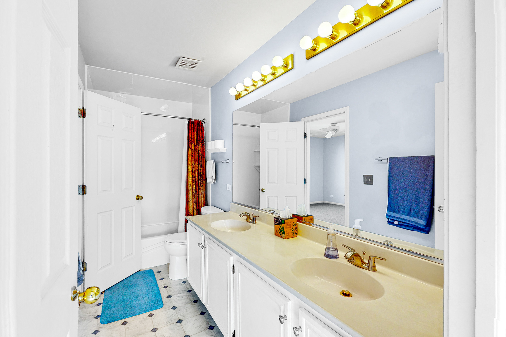 1645 Apple Tree Lane West Chicago, IL 60185 - Photo 12 of 20 a bathroom with a sink mirror and a shower