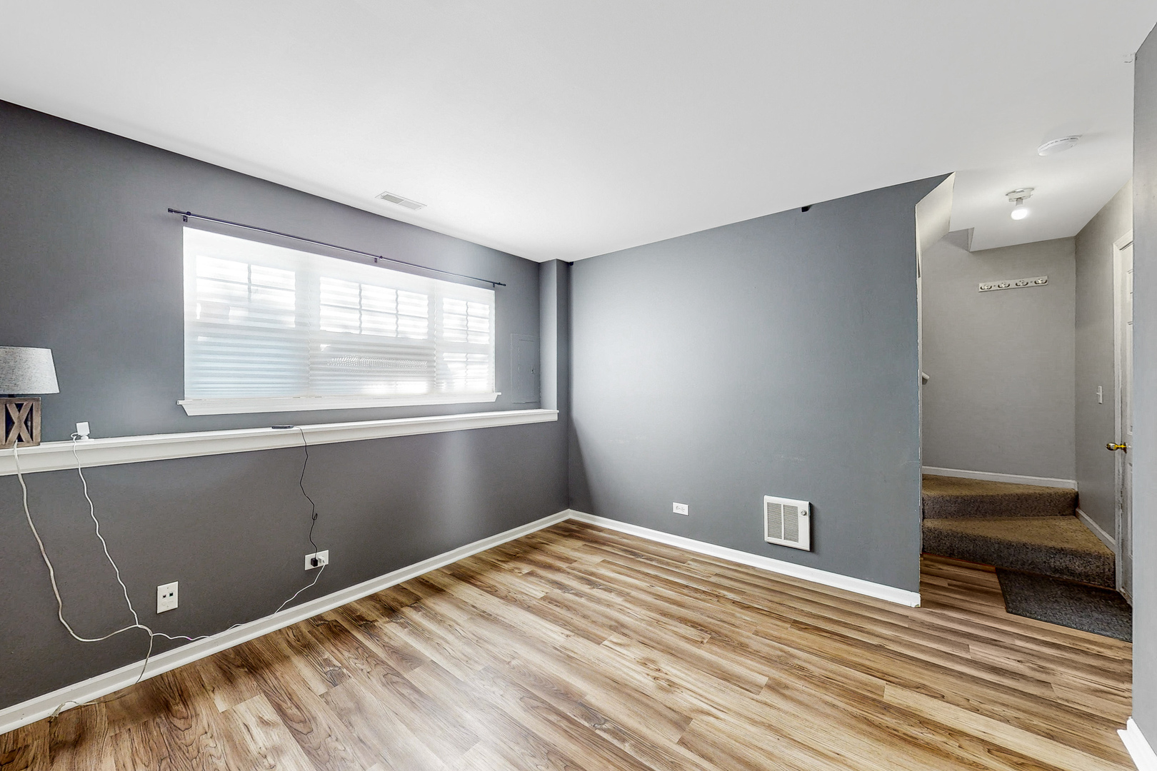 1645 Apple Tree Lane West Chicago, IL 60185 - Photo 15 of 20 a view of empty room with window and wooden floor