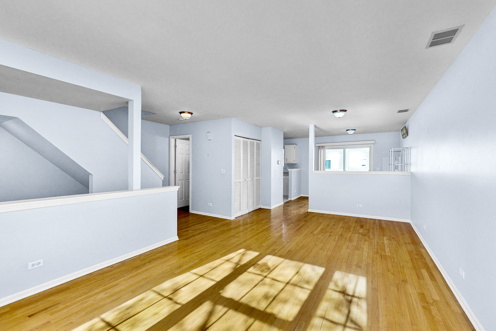 1645 Apple Tree Lane West Chicago, IL 60185 - Photo 2 of 20 a view of a bedroom with wooden floor and windows