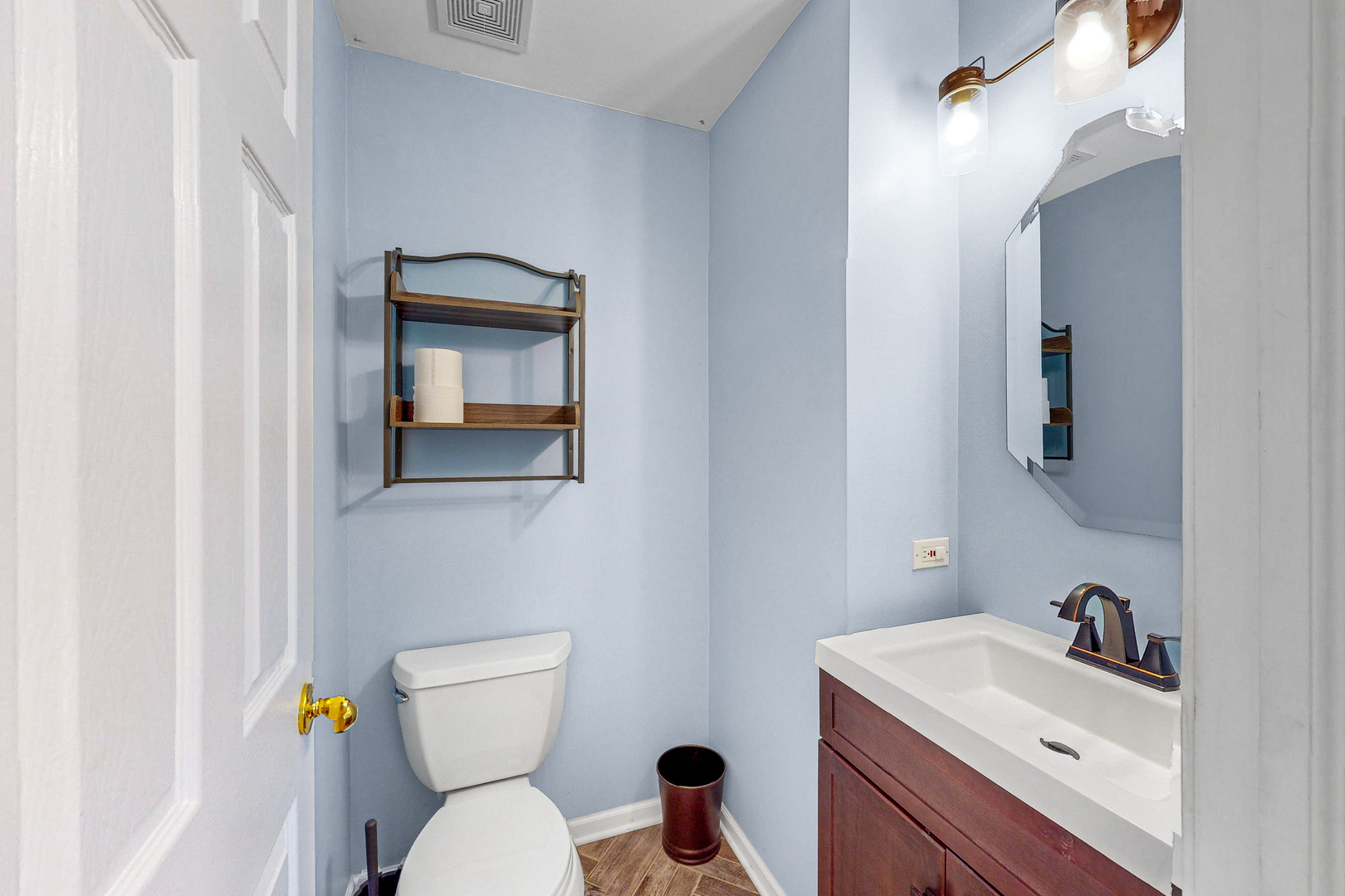 1645 Apple Tree Lane West Chicago, IL 60185 - Photo 7 of 20 a bathroom with a toilet a sink and mirror