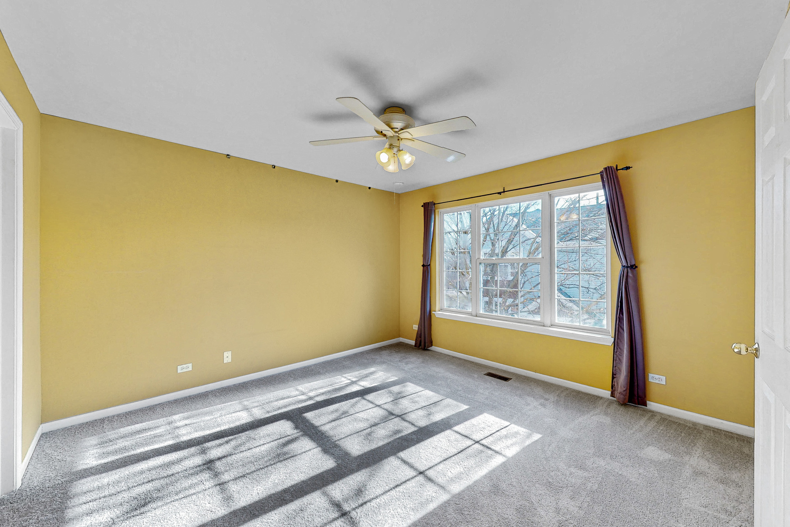 1645 Apple Tree Lane West Chicago, IL 60185 - Photo 10 of 20 a view of an empty room with a window