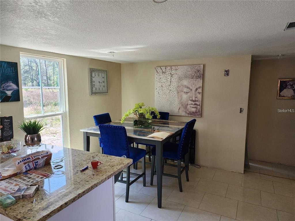 4130 Vinson Road Lakeland, FL 33810 - Photo 2 of 8 a view of a dining room with furniture and window