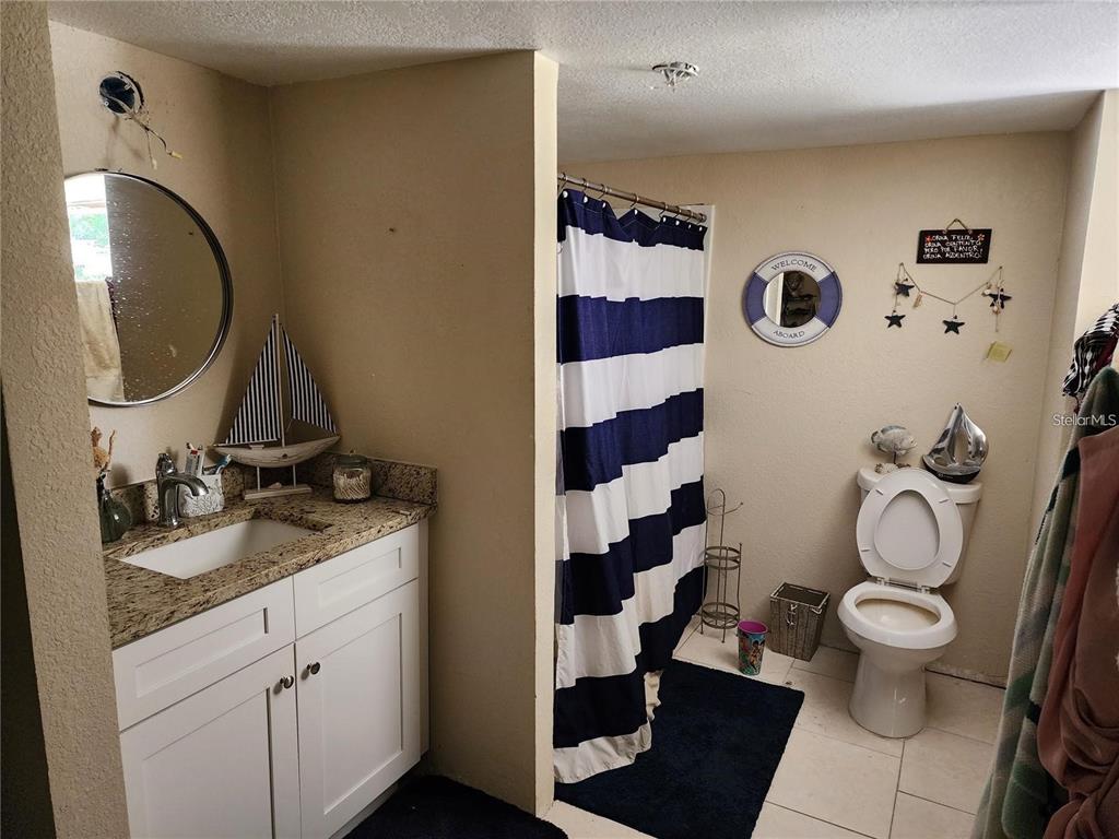 4130 Vinson Road Lakeland, FL 33810 - Photo 4 of 8 a bathroom with a sink and a mirror