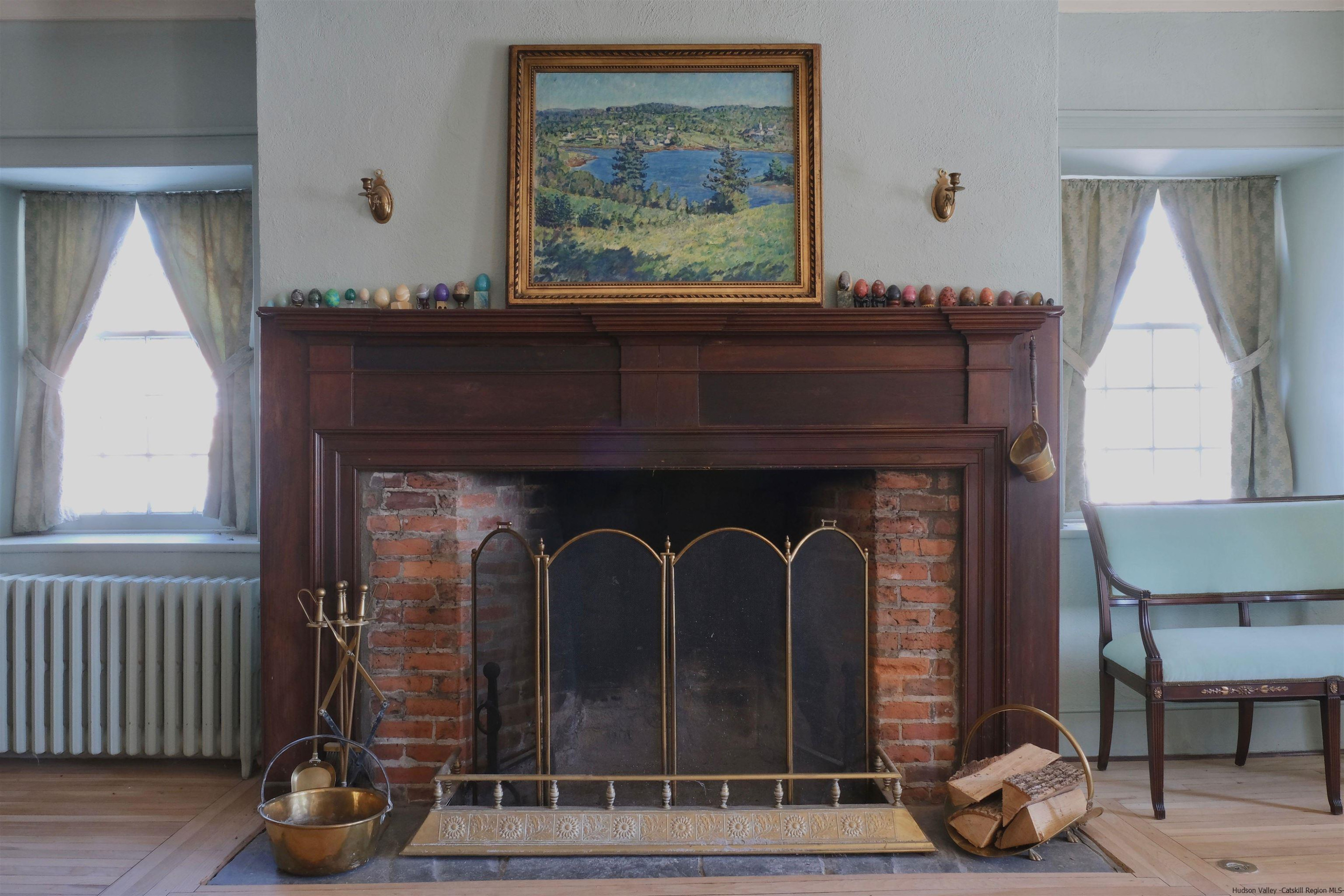 115 Buck Road Stone Ridge, NY 12484 - Photo 11 of 35 a living room with furniture and a fireplace