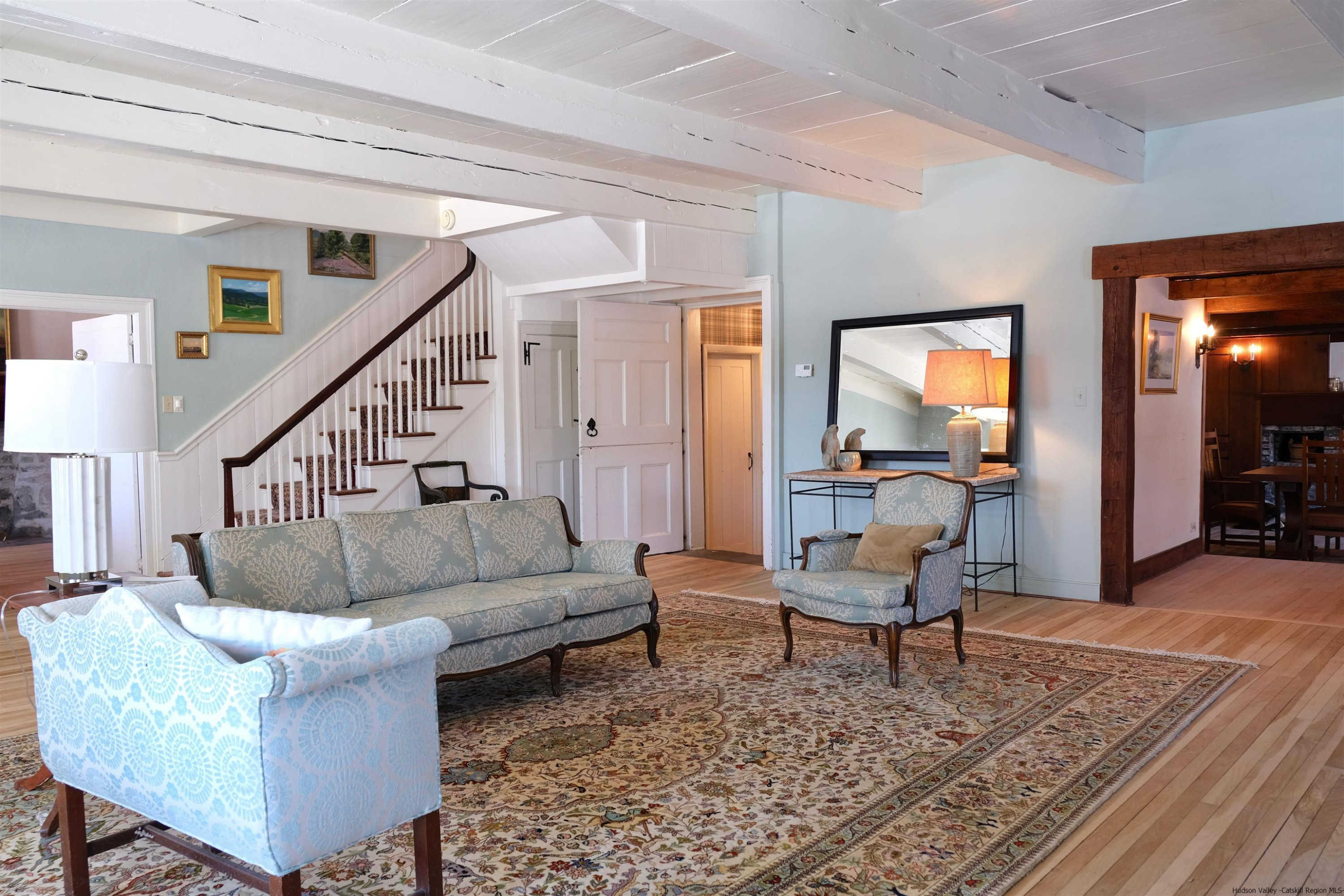 115 Buck Road Stone Ridge, NY 12484 - Photo 12 of 35 a living room with furniture and a rug