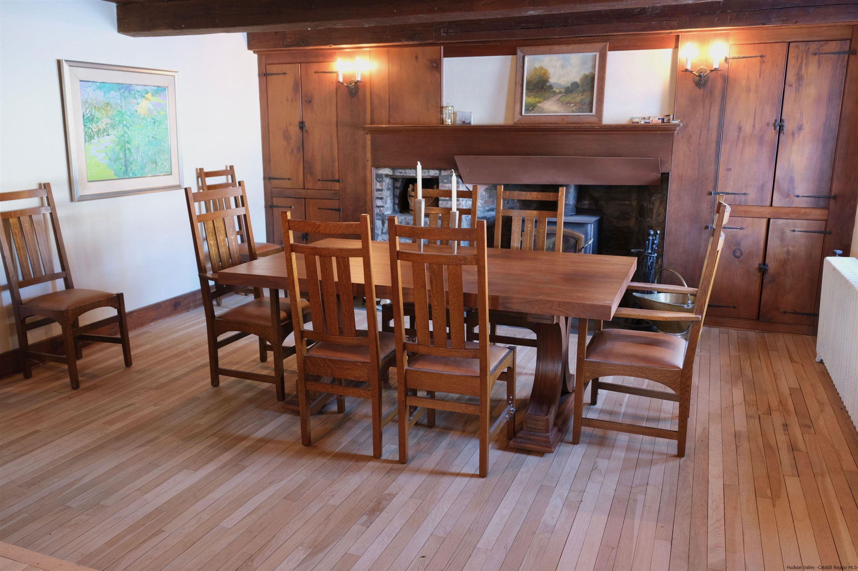 115 Buck Road Stone Ridge, NY 12484 - Photo 15 of 35 a view of a dining room with furniture and wooden floor